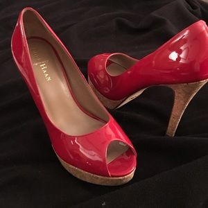 Red Patent leather peep toe platform heels.